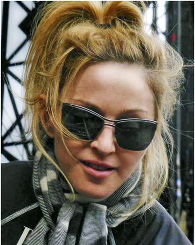 Madonna without makeup with a messy hairstyle