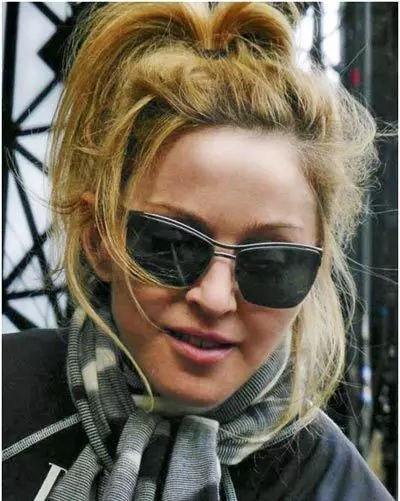 Madonna without makeup with a messy hairstyle
