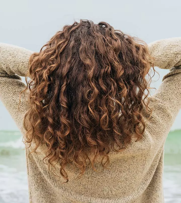 Woman sleeping on a pillow with curly hair