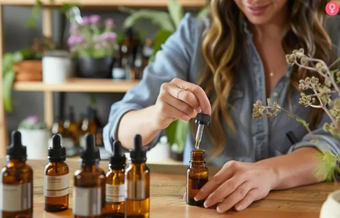 A woman formulating perfume at her home