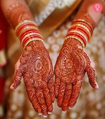 A woman with mehandi on hands