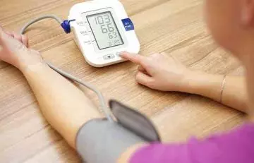 Woman checking blood pressure 