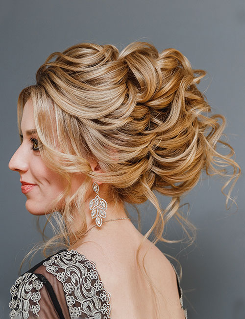 Curly tendrils updo Indian bridal hairstyle