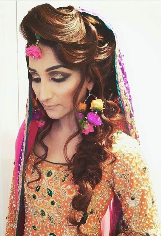 Dramatic loose braid Indian bridal hairstyle