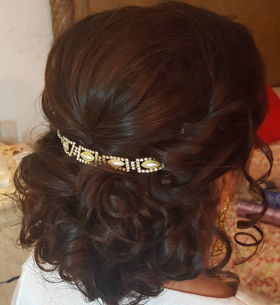 Fancy clip curly bun Indian bridal hairstyle