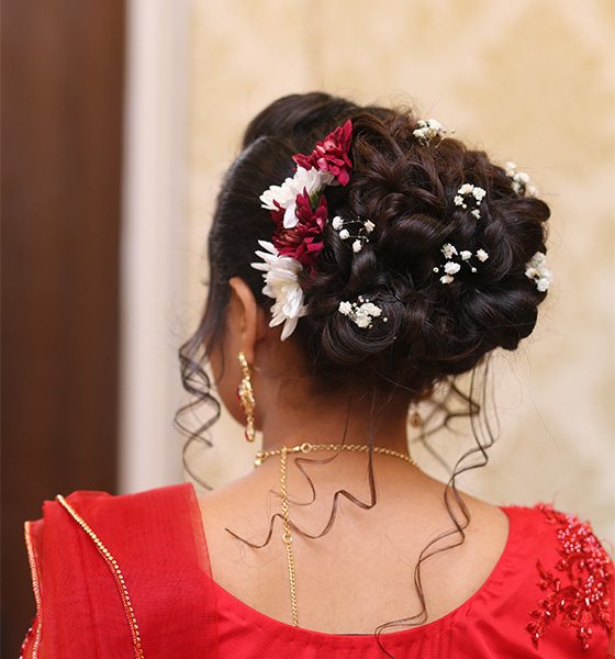 Intricate floral updo Indian bridal hairstyle