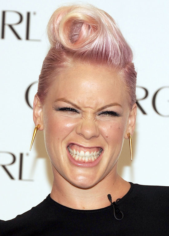 Funky light pink wavy spikes hairstyle for short hair