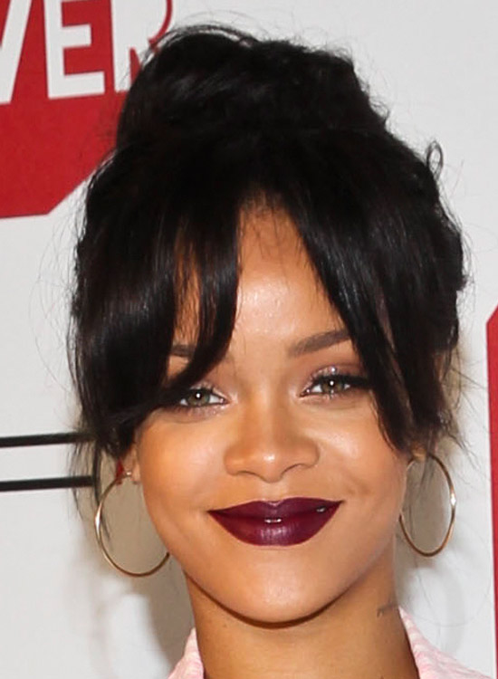 Rihanna sporting long bangs and bun