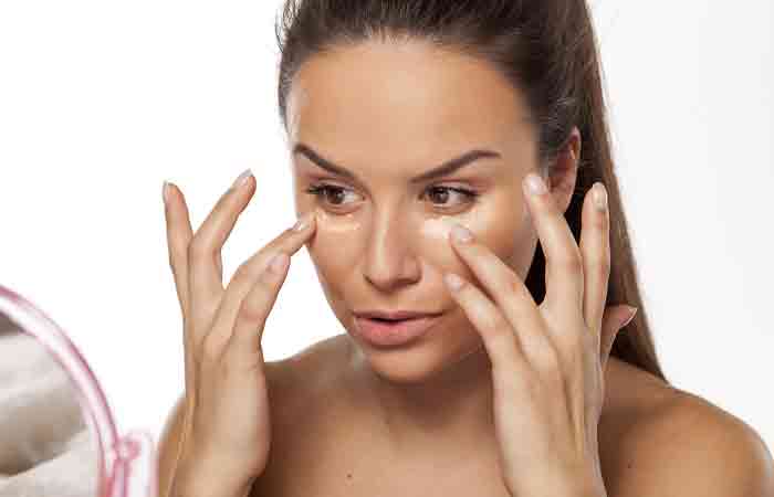 Woman applying primer for long lasting makeup