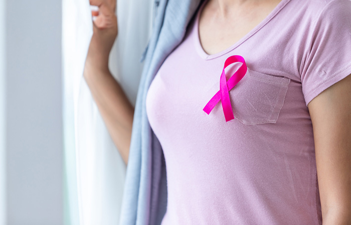 Woman wearing breast cancer pink ribbon