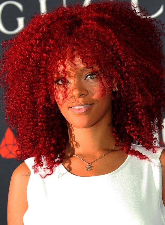 Rihanna sporting a red afro mane hairstyle