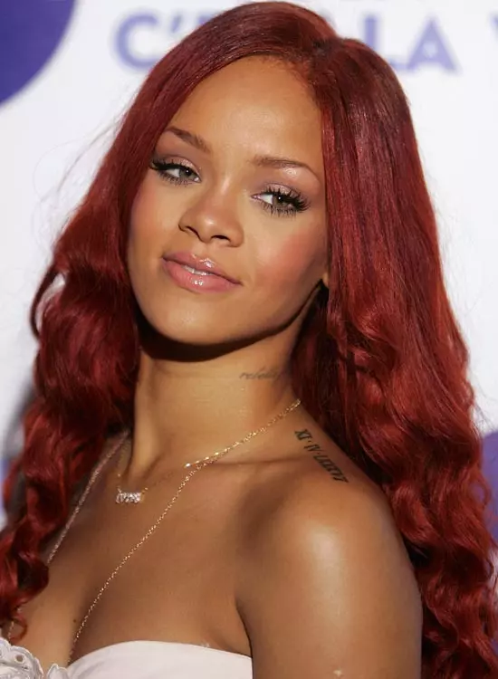 Rihanna sporting her red braided curls