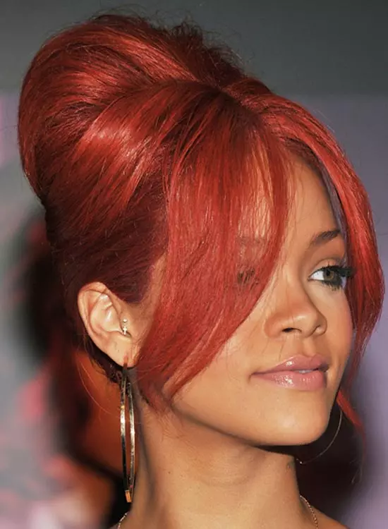 Rihanna sporting a red edgy bouffant
