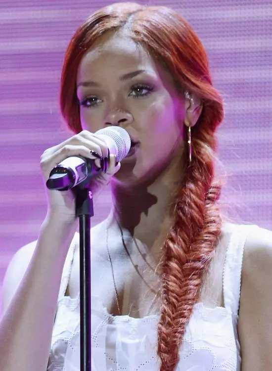 Rihanna sporting a red fish tail hairstyle