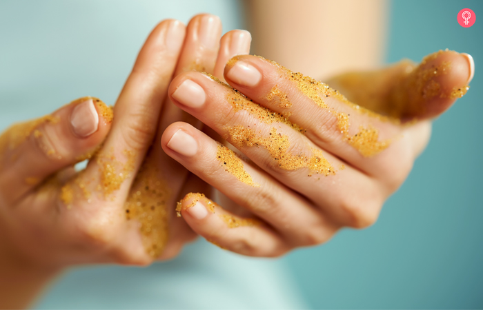 Scrubbing with a face exfoliator to remove mehndi