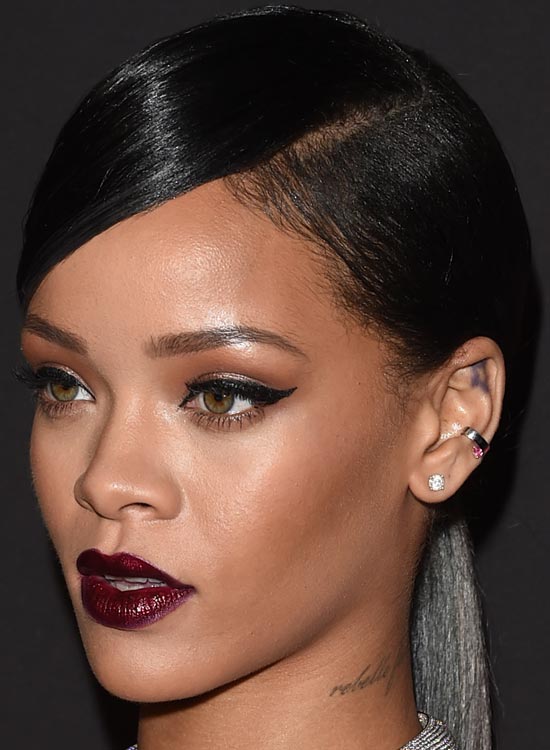 Rihanna sporting a sleek side swept hairstyle