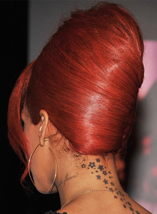 Rihanna sporting a high rouge french bun