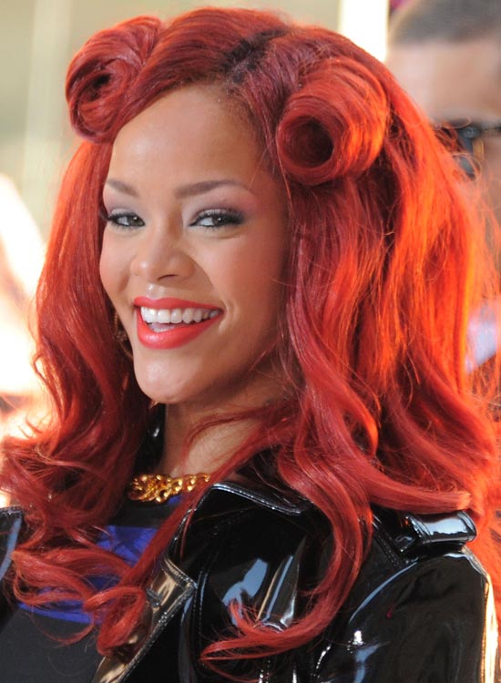 Rihanna sporting her red horny curls hairdo