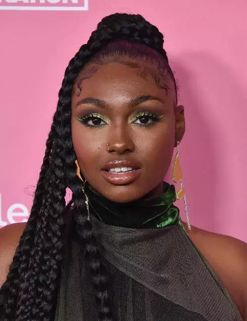 Tiana Major9 with a braided ponytail
