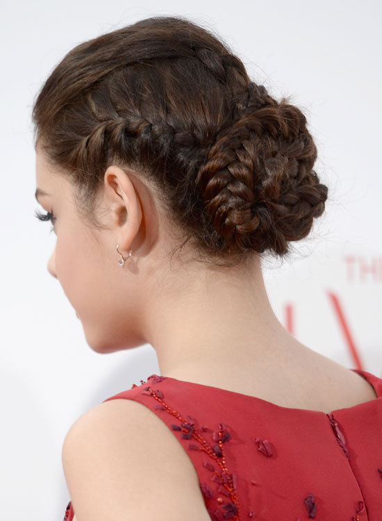 Tight multi-braided bun with slightly puffy top for girls