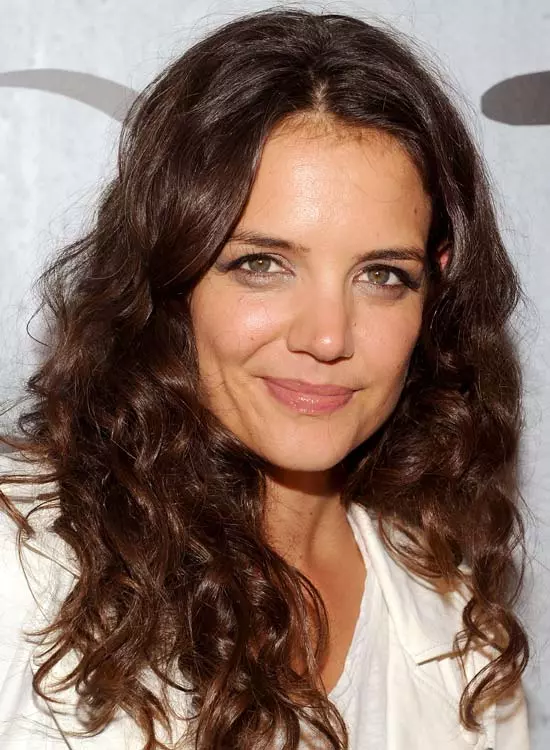 Messy tousled tight curl hairstyle
