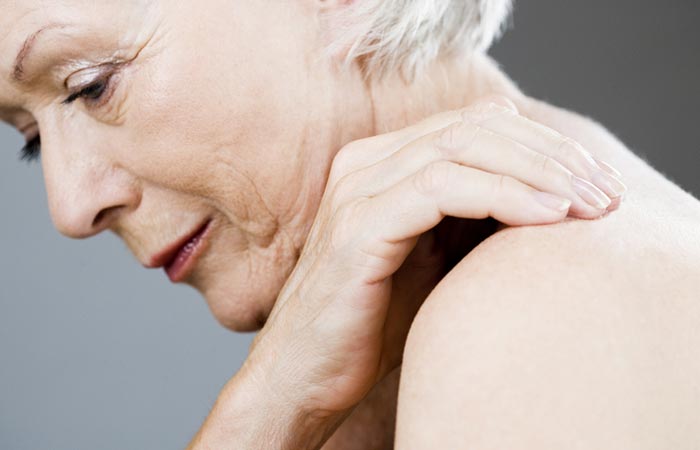 Woman with joint pain due to inflammation