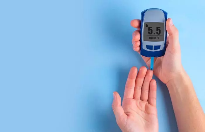 Woman measuring blood glucose levels