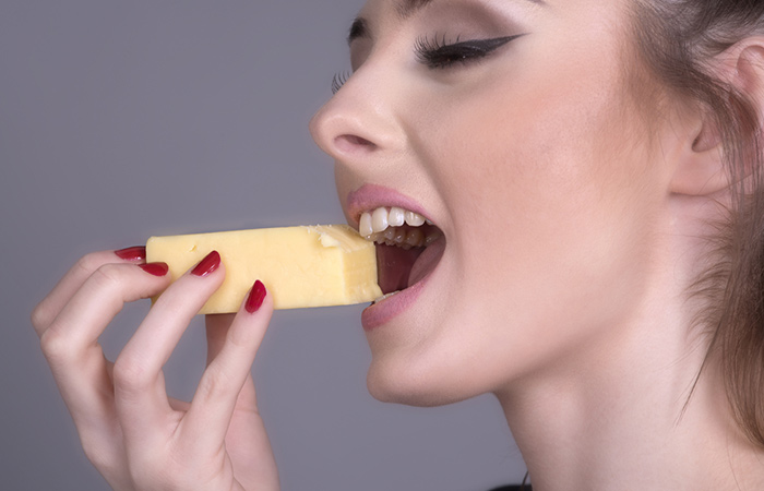 Woman chewing cheese may enjoy good dental health