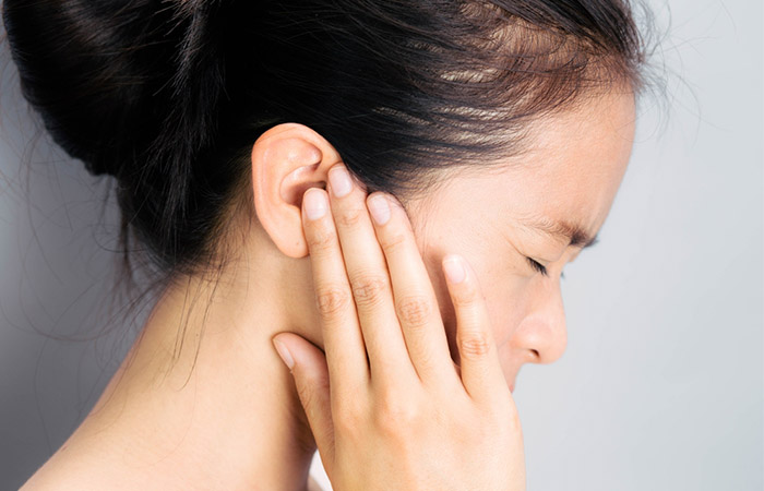 Woman having pain due to ear infection