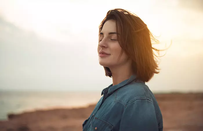 Woman feeling calm after performing balasana