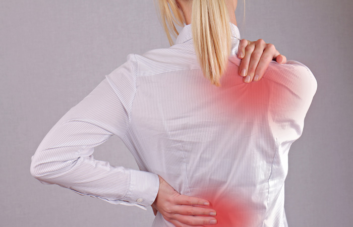 Woman with back and shoulder pain may benefit from balasana