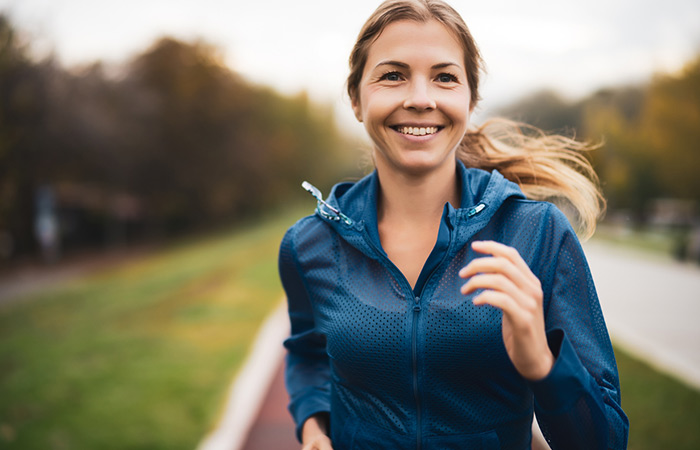 Woman running and smiling