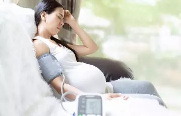 Pregnant woman experiencing hypertension due to excessive black salt consumption