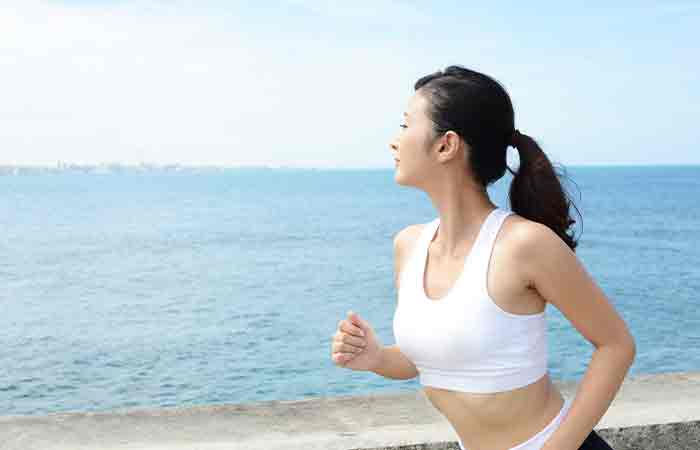 Woman jogging with healthy kidney and liver 