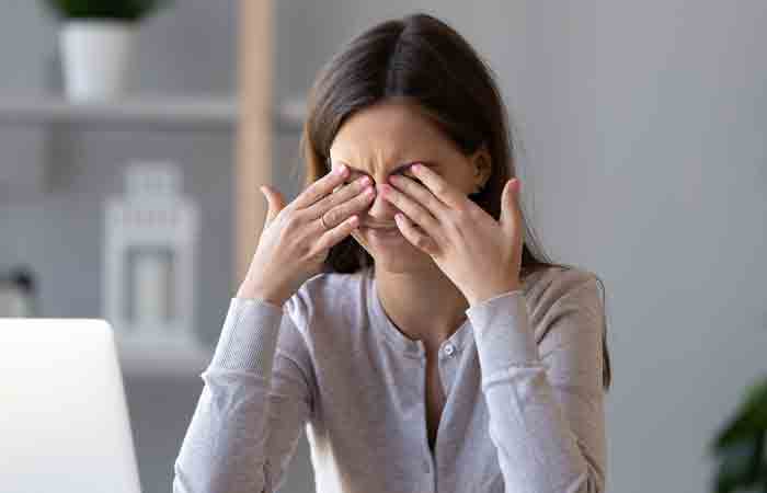 Woman rubbing her dry eyes may benefit from honey