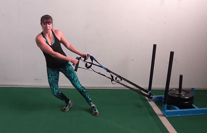 Lateral sled drag exercise for legs and thighs