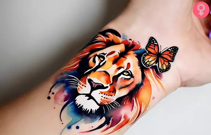 Lion and butterfly tattoo on the wrist