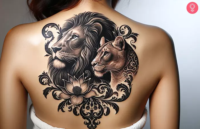 Lion and lioness tattoo on the upper back