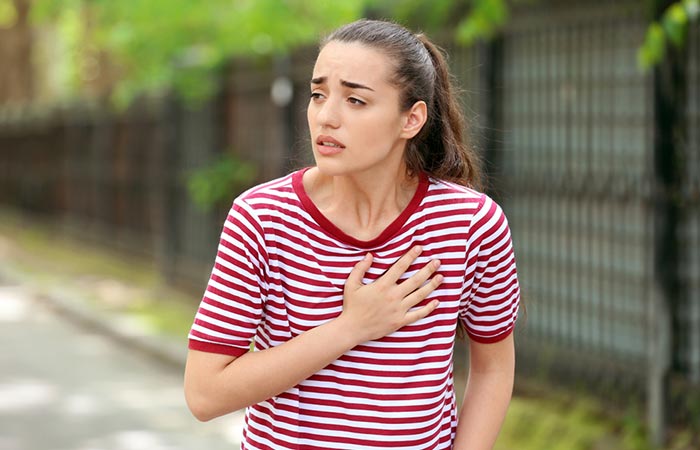 Woman experiencing irregular heart rhythm as a side effect of having bitter gourd