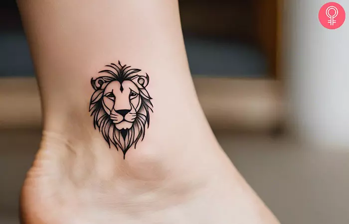 Minimalist lion tattoo on the ankle