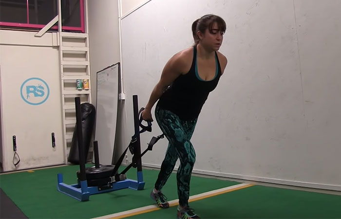 Sled drag exercise for legs and thighs