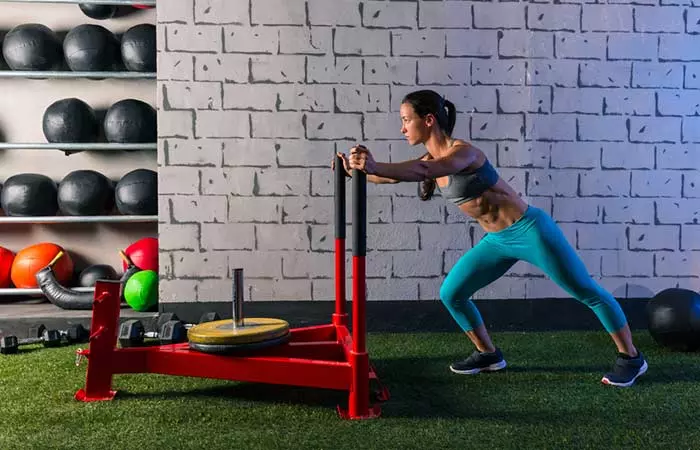 Sled push exercise for legs and thighs