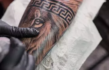 Trending lion eyes tattoo design