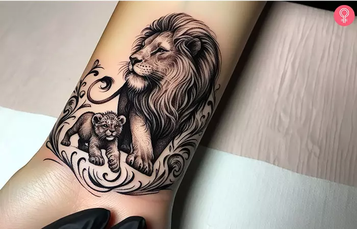 Woman with Lion and cub tattoo on her wrist