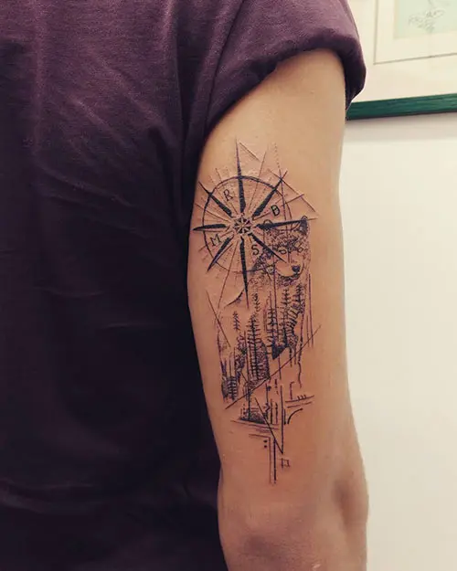 Compass tattoo design behind the arm