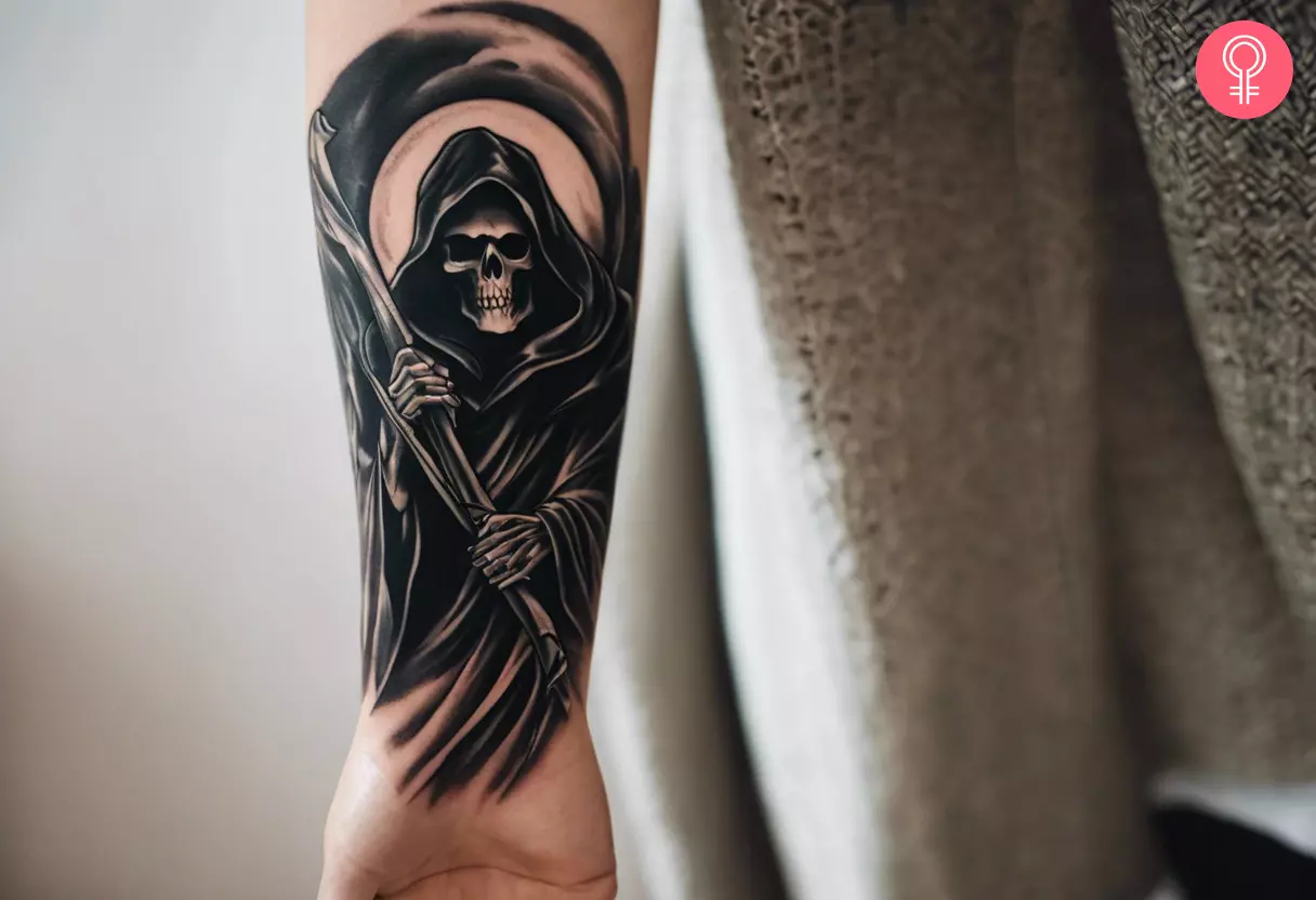 A grim reaper tattoo design on the forearm of a woman