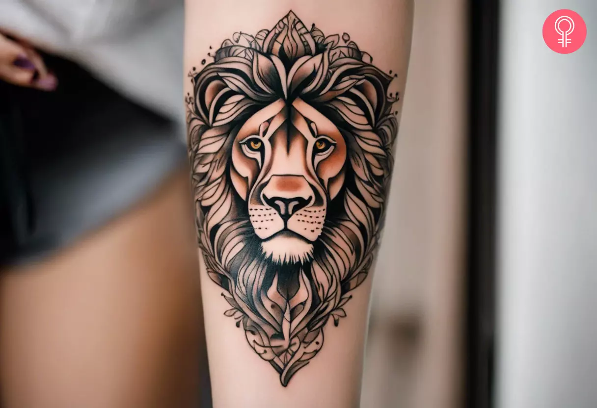 A lion tattoo design on the forearm of a woman