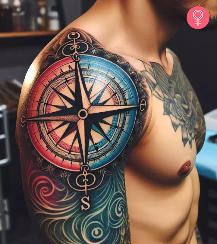 A man with a colorful compass tattoo on the arm.