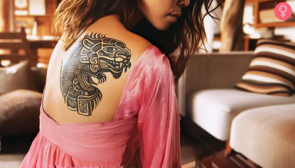 A traditional Mayan jaguar tattoo on a woman’s shoulder blade