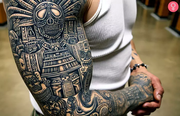 A man with an Aztec prison tattoo on his sleeve